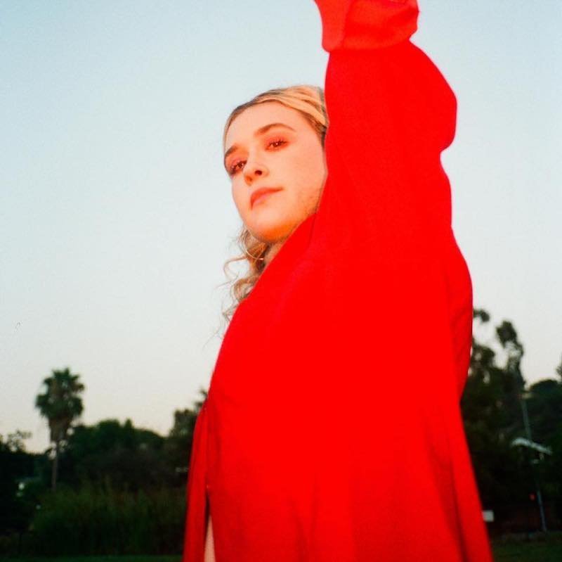 BAUM press photo in red outfit