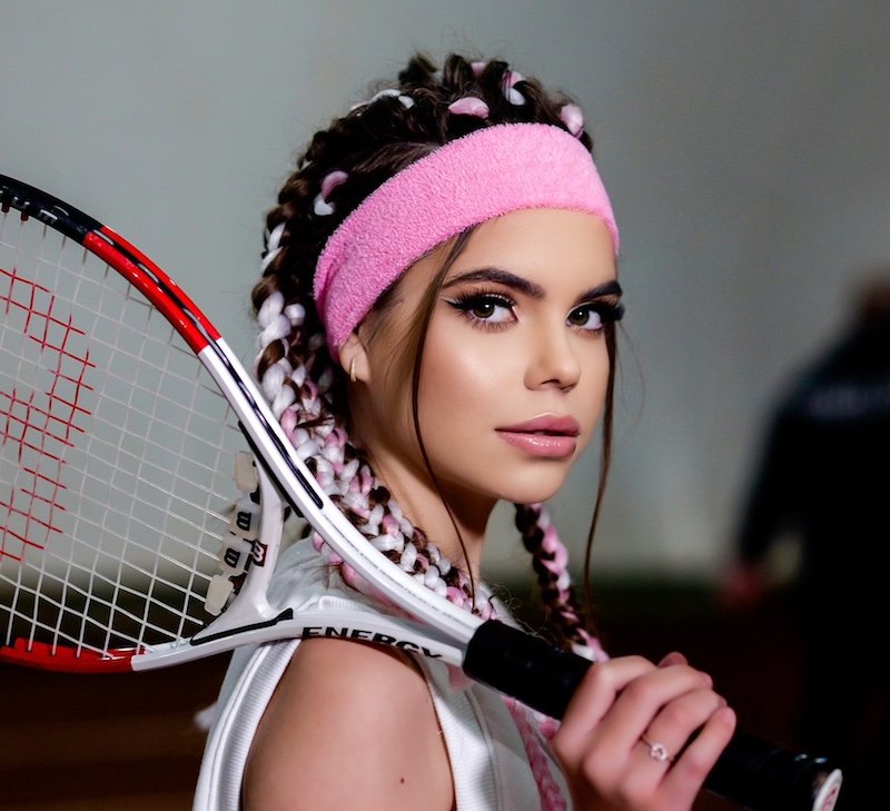 Alessiah press photo posing as a tennis player 