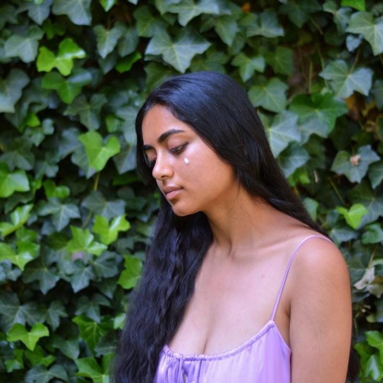 EASHA press photo outside wearing a purple outfit