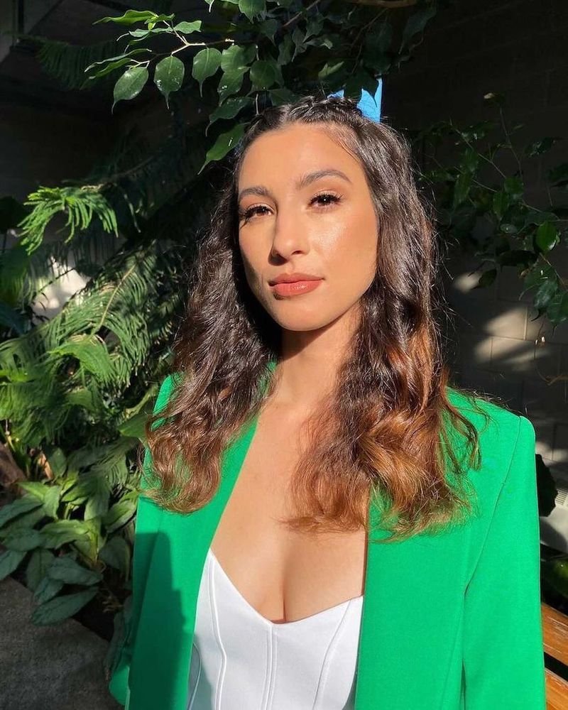 Gracie Ella press photo wearing a green blazer