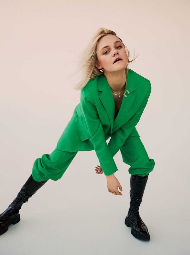 mags press photo wearing a green outfit